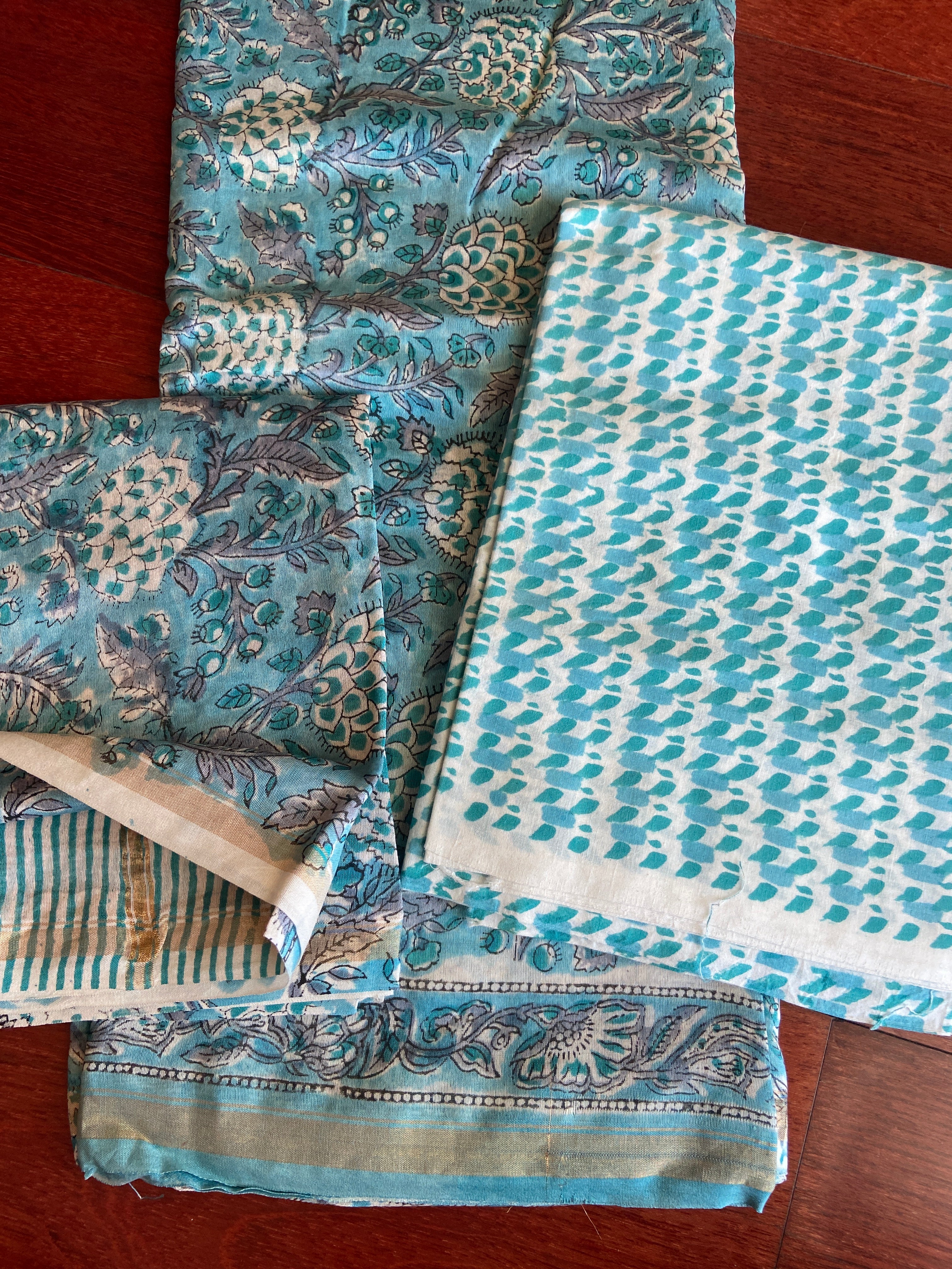 Complete Peacock Blue Chanderi 3-piece set flat lay - teal kurta with padded motifs, striped dupatta with gold borders, teal geometric print pant fabric - ethereal Chanderi handloom, Madhya Pradesh | Bloomton Designs